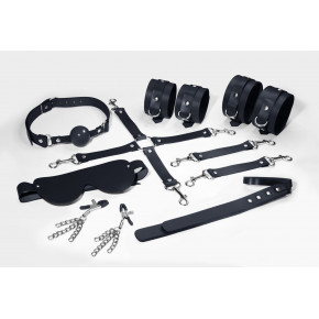 Feral Feelings | Набор Feral Feelings BDSM Kit 7 Black, наручники, поножи, коннектор, маска, паддл, кляп, зажимы. Цена: 3 799 грн